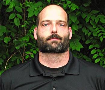 man with beard wearing black shirt
